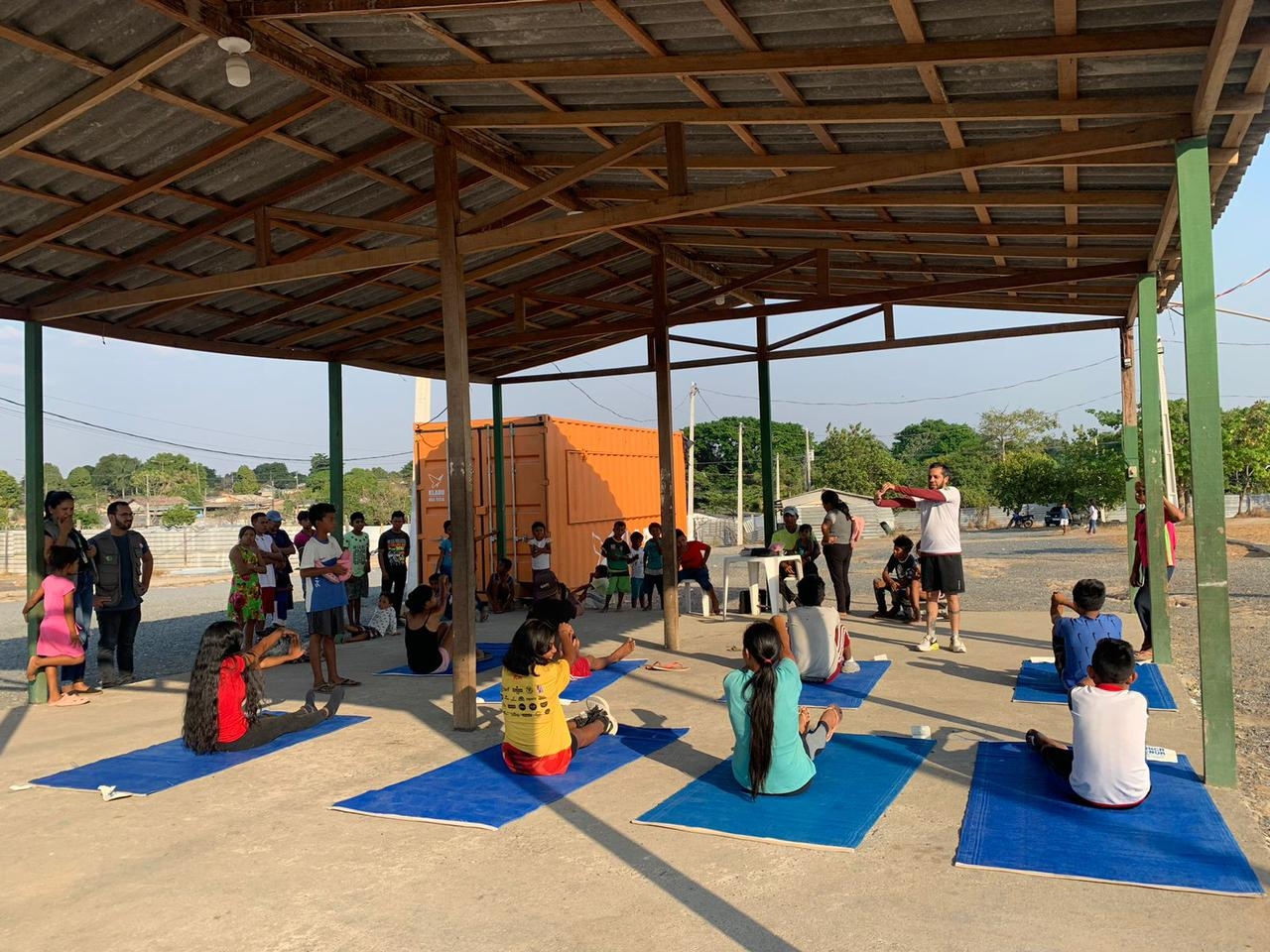 First yoga session in front of Boa Vista clubhouse after arrival of container